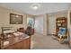 A home office with two desks, filing cabinet, and bookcase with natural light from a window at 402 Glenhurst Trce, Canton, GA 30115