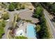 Aerial view of community pool with clubhouse surrounded by lush landscaping at 402 Glenhurst Trce, Canton, GA 30115