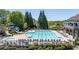 Full view of a swimming pool with lounge chairs, landscaping, and a slide feature at 402 Glenhurst Trce, Canton, GA 30115