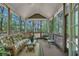 Charming screened-in porch with comfortable seating, perfect for enjoying the serene outdoor views at 402 Glenhurst Trce, Canton, GA 30115