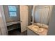Functional bathroom with a built-in vanity space and a sink with a large mirror at 4402 Sebring Walk, Decatur, GA 30034