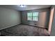 Neutral bedroom with a window providing natural light, creating a serene and inviting atmosphere at 4402 Sebring Walk, Decatur, GA 30034