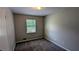 Well-lit bedroom with neutral walls and soft carpet, perfect for relaxation and comfort at 4402 Sebring Walk, Decatur, GA 30034