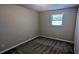 Cozy bedroom with carpet flooring and a window letting in natural light at 4402 Sebring Walk, Decatur, GA 30034