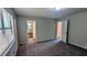 Comfortable bedroom features gray carpet and a view into a separate bathroom/vanity room at 4402 Sebring Walk, Decatur, GA 30034