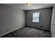 Serene bedroom with soft gray walls, carpet flooring, and a bright window at 4402 Sebring Walk, Decatur, GA 30034