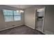 Carpeted dining room featuring neutral paint, a large window, and adjacent doorway at 4402 Sebring Walk, Decatur, GA 30034
