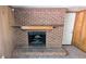 Classic brick fireplace with wooden mantel, adding warmth and charm to the living space at 4402 Sebring Walk, Decatur, GA 30034
