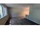 Carpeted living room featuring neutral paint, a large window, and an open floor plan at 4402 Sebring Walk, Decatur, GA 30034