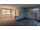 Open-concept living room featuring carpet floors, neutral paint, and an adjacent dining area at 4402 Sebring Walk, Decatur, GA 30034