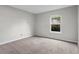Neutral bedroom featuring carpet flooring and a bright window view at 1150 Collier Nw Rd # E3, Atlanta, GA 30318
