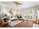 Bright living room featuring stylish furnishings, hardwood floors, and sliding glass doors to bring in natural light at 1150 Collier Nw Rd # E3, Atlanta, GA 30318