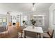 Open-concept living area connecting to the dining space, filled with natural light at 1150 Collier Nw Rd # E3, Atlanta, GA 30318