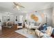 Comfortable living area with a ceiling fan, stylish furniture, and adjacent dining space at 1150 Collier Nw Rd # E3, Atlanta, GA 30318