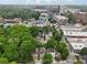 Aerial view of houses surrounded by lush greenery and mature trees in a vibrant urban setting at 737 St Charles Ne Ave, Atlanta, GA 30306