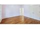 Spacious bedroom with gleaming hardwood floors, light walls, a closet, and an entry door at 737 St Charles Ne Ave, Atlanta, GA 30306
