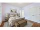 This cozy bedroom includes a soft color pallet, neutral textures and wood floors at 737 St Charles Ne Ave, Atlanta, GA 30306