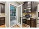 Updated kitchen with stainless steel appliances and door leading to outdoor deck at 737 St Charles Ne Ave, Atlanta, GA 30306