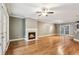 Spacious living room boasts gleaming hardwood floors and a cozy fireplace at 737 St Charles Ne Ave, Atlanta, GA 30306