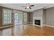 Cozy living room features hardwood floors, a fireplace, and access to a balcony at 737 St Charles Ne Ave, Atlanta, GA 30306