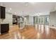 Spacious living room featuring hardwood floors, natural light, and open layout to the modern kitchen at 737 St Charles Ne Ave, Atlanta, GA 30306