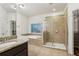 A spacious main bathroom features a shower, tub, walk in closet and tile floors at 737 St Charles Ne Ave, Atlanta, GA 30306
