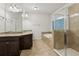 A spacious main bathroom features double sinks, walk in shower, tub and tile floors at 737 St Charles Ne Ave, Atlanta, GA 30306
