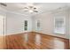 A spacious main bedroom features hardwood floors, white paint and a door to the outside at 737 St Charles Ne Ave, Atlanta, GA 30306