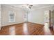 A spacious main bedroom features hardwood floors, white paint and a ceiling fan at 737 St Charles Ne Ave, Atlanta, GA 30306