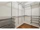 A spacious walk in closet features wire shelving and wood floors at 737 St Charles Ne Ave, Atlanta, GA 30306