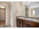 Bathroom with a double-sink vanity, granite countertops, and a linen closet at 115 Oakwood Dr, Covington, GA 30016