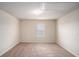 Spacious bonus room featuring carpet and a window for natural light at 115 Oakwood Dr, Covington, GA 30016