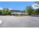 Community center with ample parking, landscaping, and charming architectural details at 115 Oakwood Dr, Covington, GA 30016
