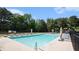 Community pool surrounded by lounge chairs, offering a relaxing amenity at 115 Oakwood Dr, Covington, GA 30016