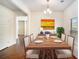 Dining room with hardwood floors and a six seat table at 115 Oakwood Dr, Covington, GA 30016