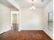 Dining room with hardwood floors and natural light streaming through the window at 115 Oakwood Dr, Covington, GA 30016