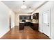 Kitchen with dark cabinetry, stone countertops, and a convenient center island at 115 Oakwood Dr, Covington, GA 30016