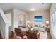Cozy living room with stylish furnishings, wood floors, and natural light streaming through the windows at 115 Oakwood Dr, Covington, GA 30016