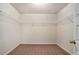 Spacious walk-in closet featuring wire shelving for optimal organization at 115 Oakwood Dr, Covington, GA 30016