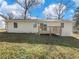 Home backyard featuring a deck, newly painted siding, and well-maintained landscaping, great for relaxing at 1783 Big Valley Ln, Stone Mountain, GA 30083