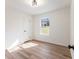 Bright bedroom with natural light from the window and light colored floors at 1783 Big Valley Ln, Stone Mountain, GA 30083