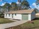 Beautiful home with a large garage and stone accents on the facade at 1783 Big Valley Ln, Stone Mountain, GA 30083