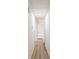 Bright hallway with light colored flooring and doors at 1783 Big Valley Ln, Stone Mountain, GA 30083