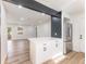 Open kitchen with stainless steel refrigerator, white cabinets, and a center island at 1783 Big Valley Ln, Stone Mountain, GA 30083