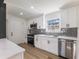 Modern kitchen with stainless steel appliances, stylish backsplash, and quartz countertops at 1783 Big Valley Ln, Stone Mountain, GA 30083