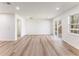 Open living room featuring a sliding glass door and light colored floors at 1783 Big Valley Ln, Stone Mountain, GA 30083