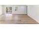 Bright living room with hardwood floors, sliding glass doors to the deck, and ample natural light at 1783 Big Valley Ln, Stone Mountain, GA 30083