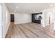 Open-concept layout featuring hardwood floors, with easy access to the kitchen and backyard at 1783 Big Valley Ln, Stone Mountain, GA 30083