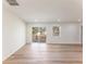Open living room featuring a sliding glass door leading to a wooden deck at 1783 Big Valley Ln, Stone Mountain, GA 30083