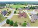 Sprawling neighborhood with well-maintained lawns and mature trees provides a peaceful setting at 401 Sara Ct, Loganville, GA 30052